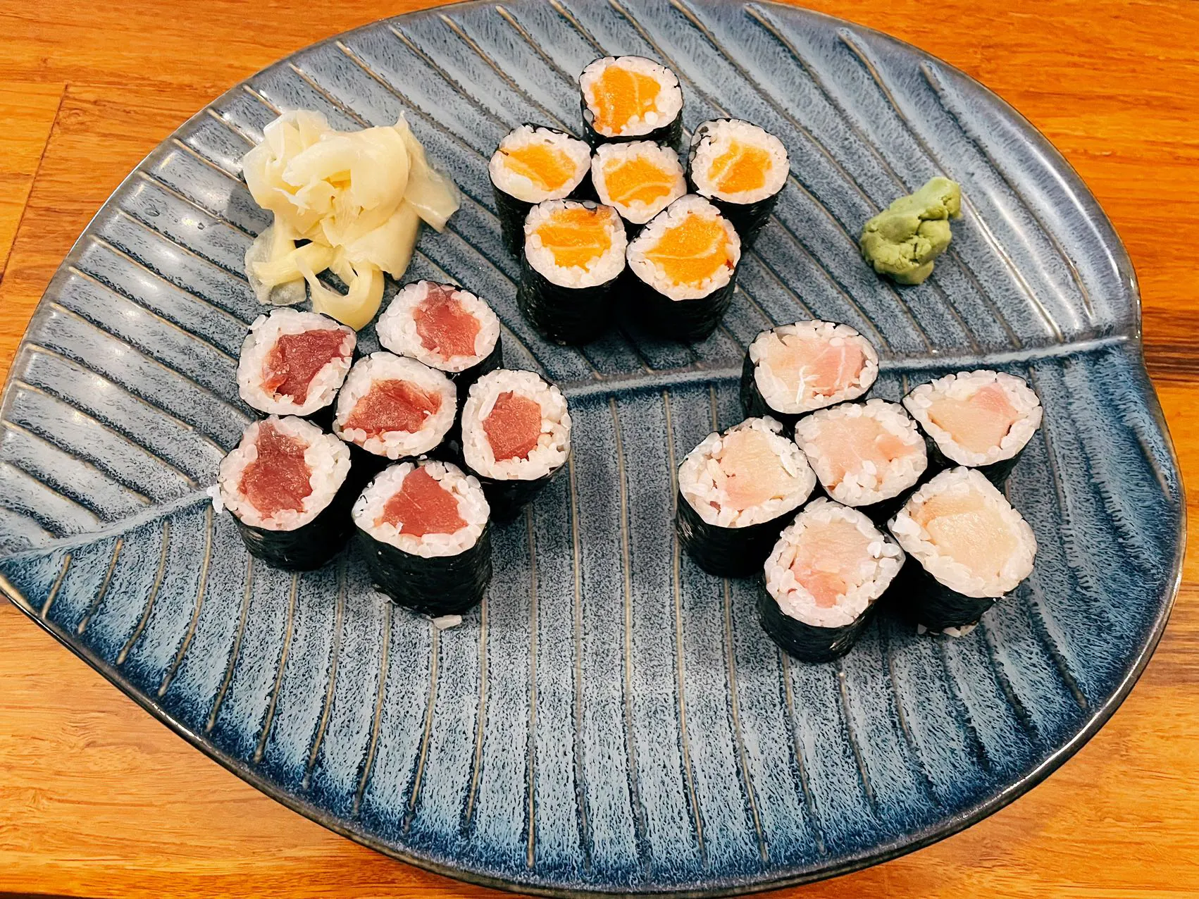 Roll combo with salmon, tuna and white fish rolls at Wukong Asian Restaurant in Hilldale